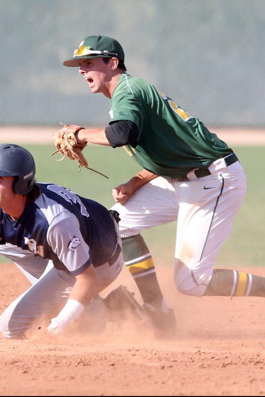 Cloud of dust with Liam Spence at second after tag-out in game two.-Oscar Perez-Pinal Central
