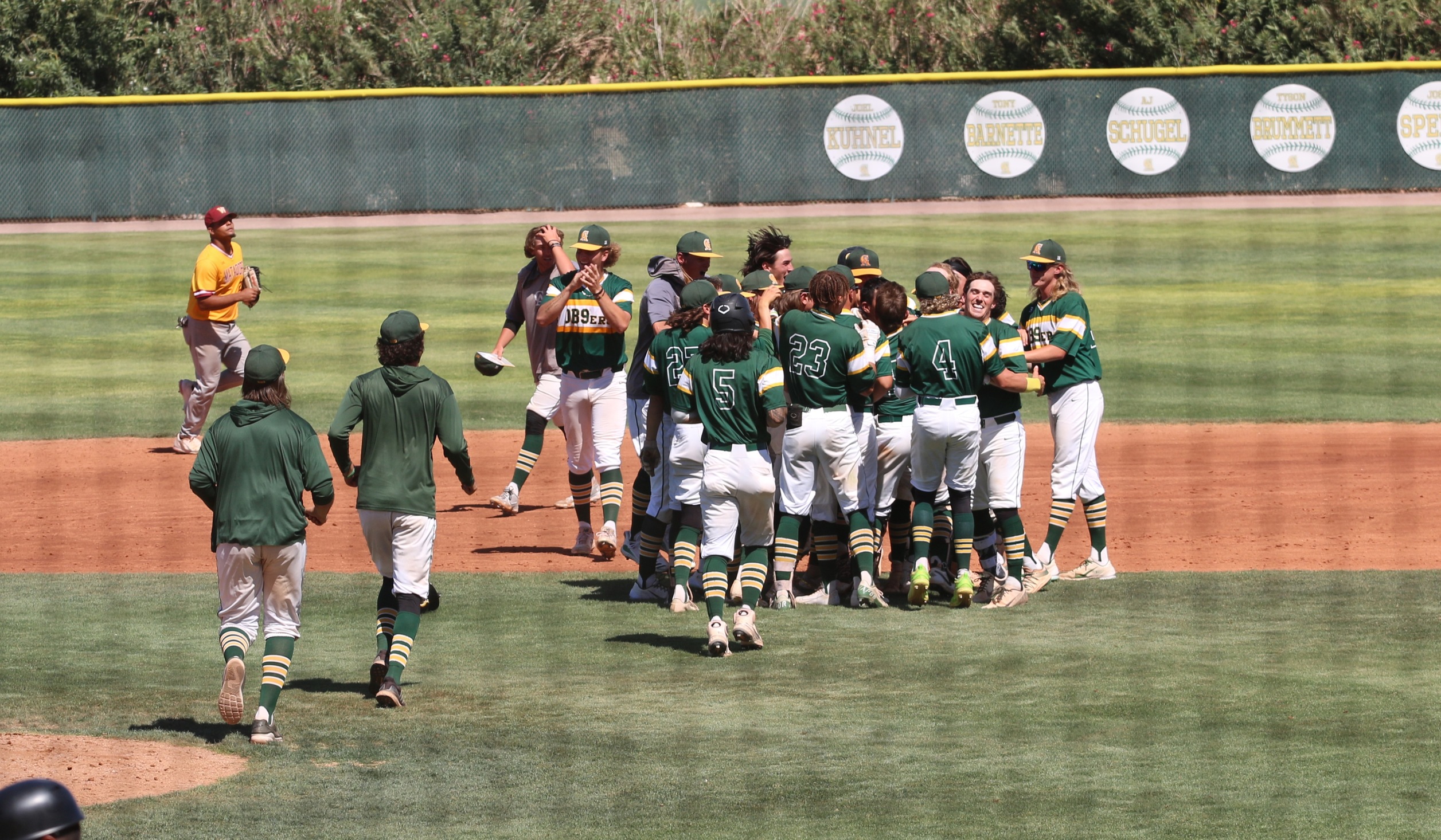 Celebration after game one 3-2 win over Western Arizona in extras Saturday at McSwain field.