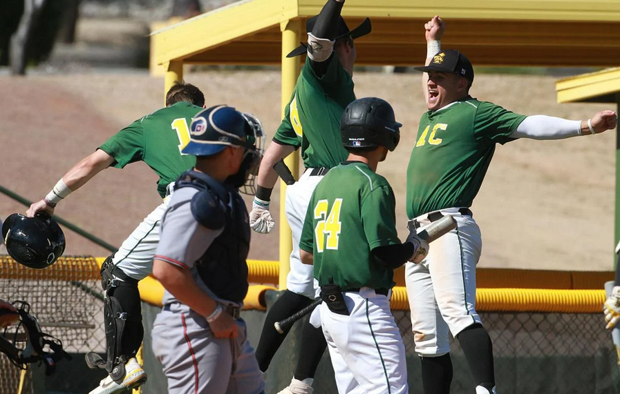 Ryan Ball (Cowboy hat) takes a team chest bump after a sixth inning homerun against Pima Community College Saturday at McSwain Field. Photo-Chip English Pinal Central